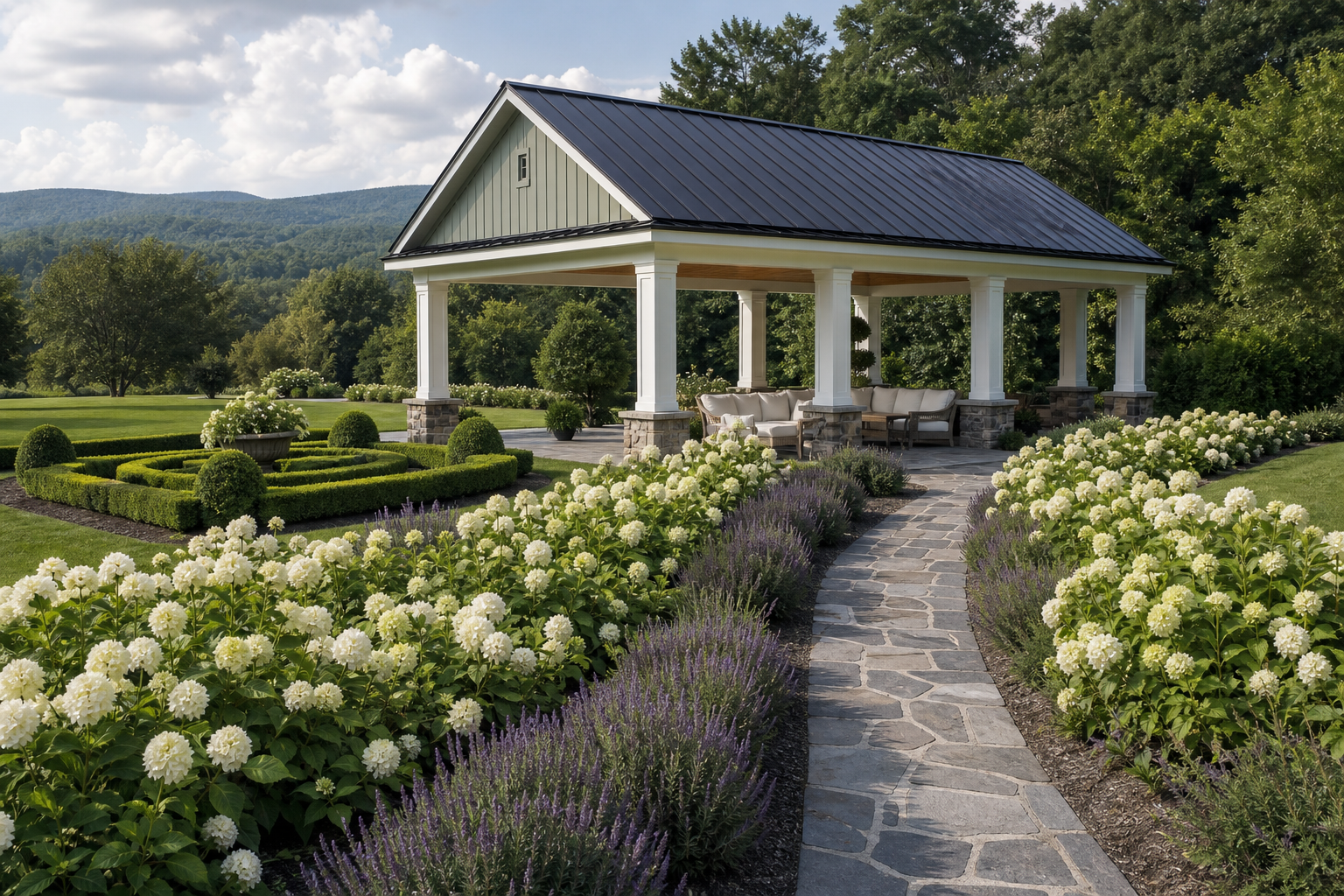 Modern farmhouse garden pavilion with sage siding, black standing-seam roof, white columns on fieldstone bases, and hydrangea-lined approach path in Norwalk